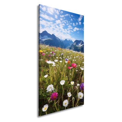 Leinwandbild Alpenblumen erblühen stolz vor majestätischer Bergkulisse. - deyoli