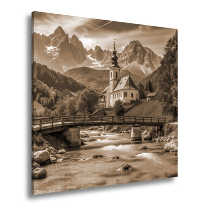Leinwandbild Alpenidylle mit Kirche, Brücke und türkisblauem Bach. - deyoli