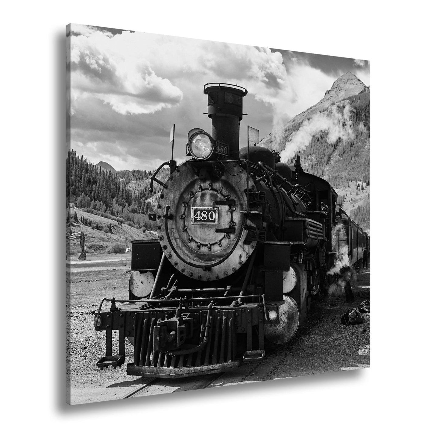 Leinwandbild Alte Dampfkraft rollt stolz durch majestätische Berge. - deyoli