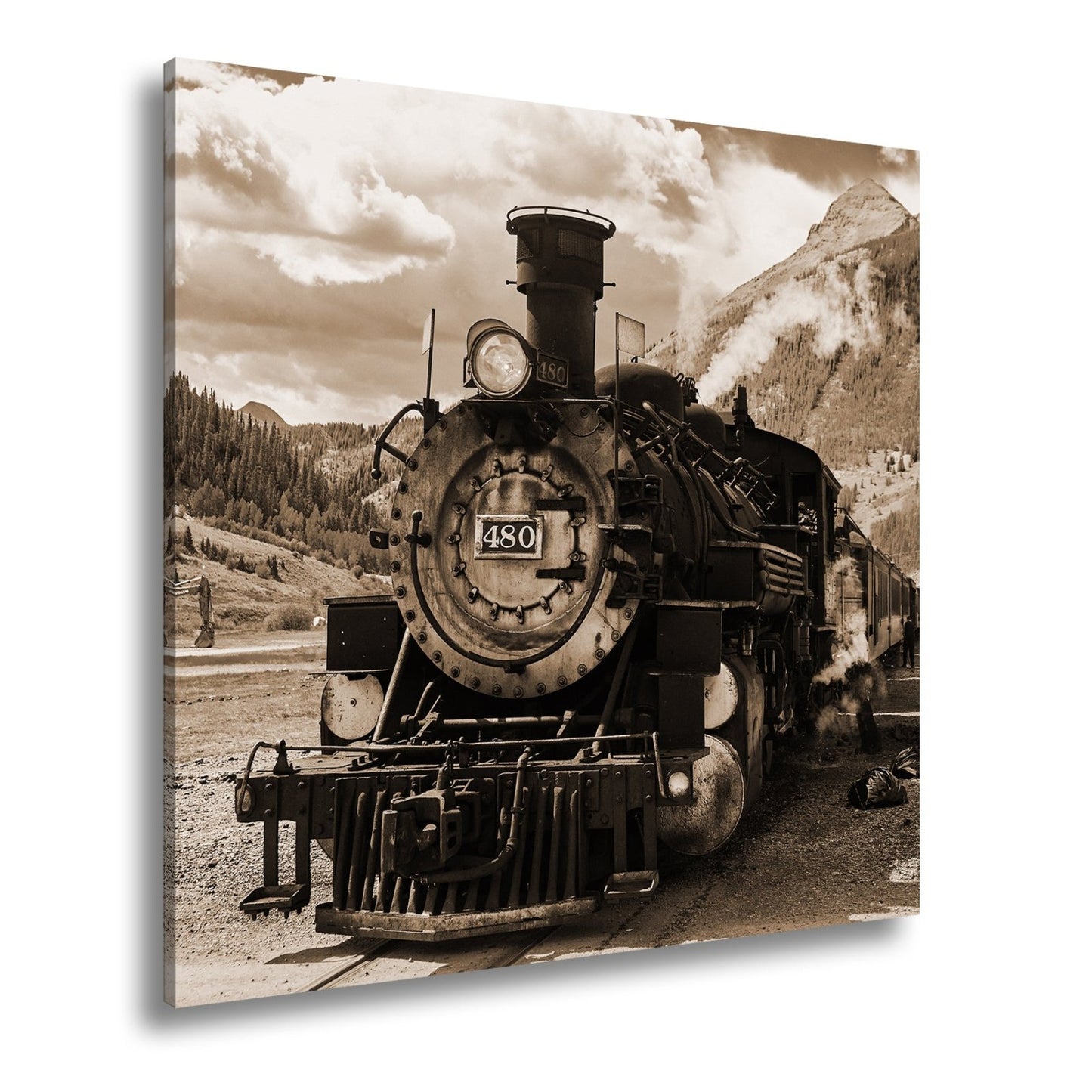 Leinwandbild Alte Dampfkraft rollt stolz durch majestätische Berge. - deyoli