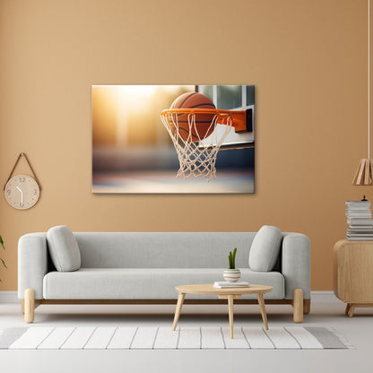 Leinwandbild Basketball versinkt elegant im Korb im sanften Licht. - deyoli