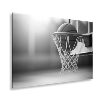 Leinwandbild Basketball versinkt elegant im Korb im sanften Licht. - deyoli