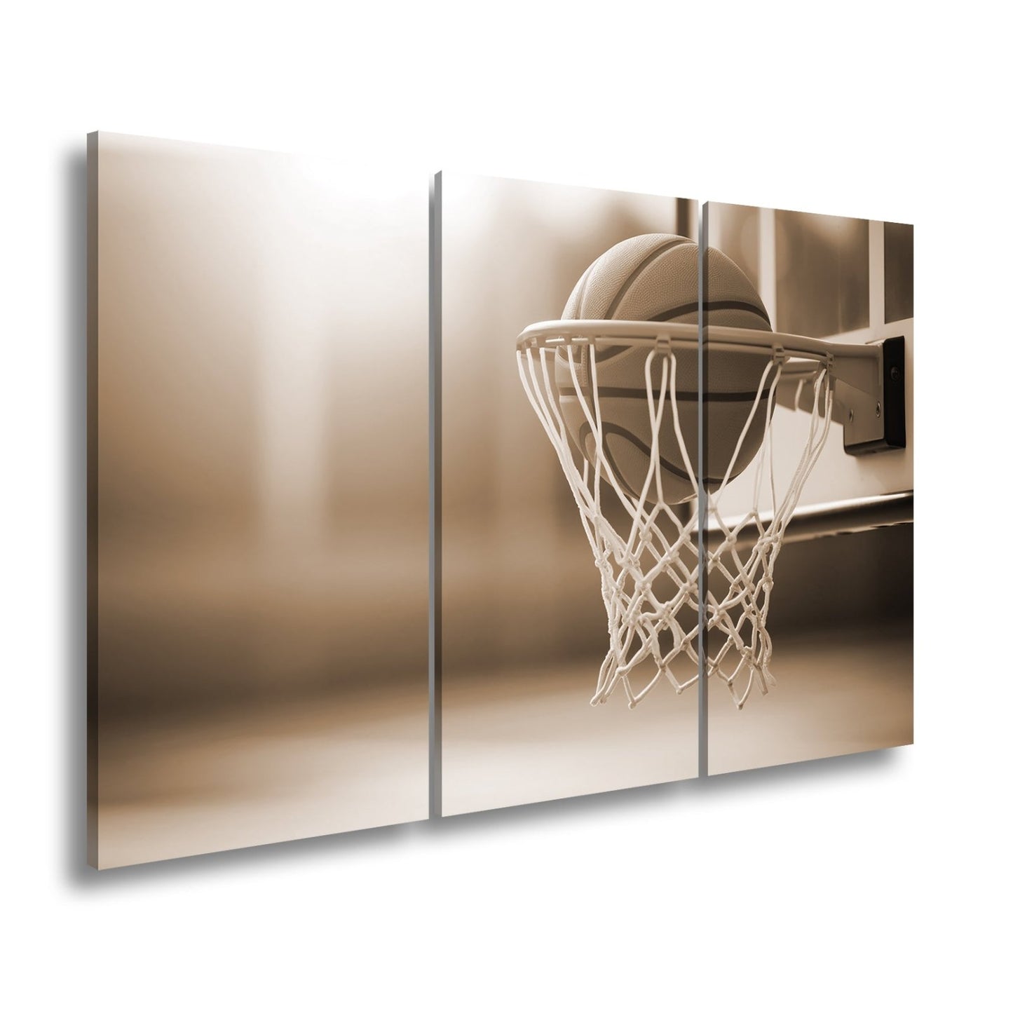 Leinwandbild Basketball versinkt elegant im Korb im sanften Licht. - deyoli