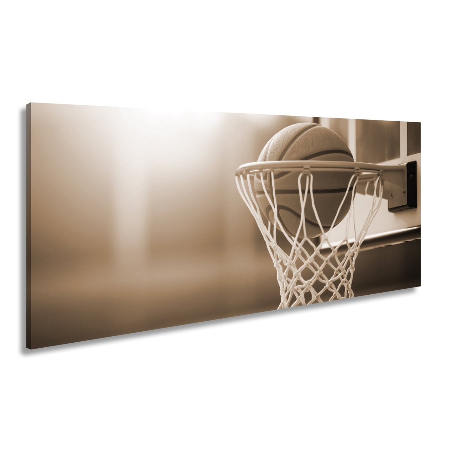 Leinwandbild Basketball versinkt elegant im Korb im sanften Licht. - deyoli