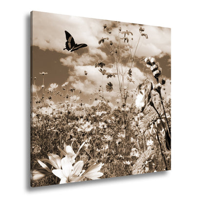 Leinwandbild Blütenmeer tanzt mit Schmetterling im Hauch des Sommers. - deyoli