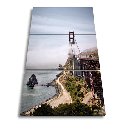 Leinwandbild Brücke im Nebel dramatische Küstenkulisse XXL – Landschaft Wandbild - deyoli