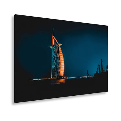 Leinwandbild Burj Al Arab XXL – Leuchtet kraftvoll in der Nacht - deyoli