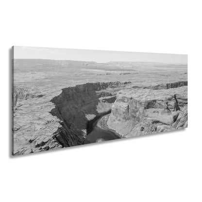 Leinwandbild Canyon XXL – Tiefe Schlucht mit grünem Fluss & Naturgewalt - deyoli