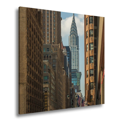 Leinwandbild Chrysler Building glänzt art - déco - elegant zwischen warmen Fassaden - deyoli