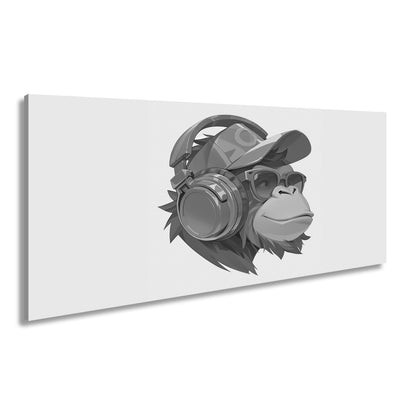 Leinwandbild Cooler Monkey mit Cap und Kopfhörern im sonnigen Streetstyle - deyoli