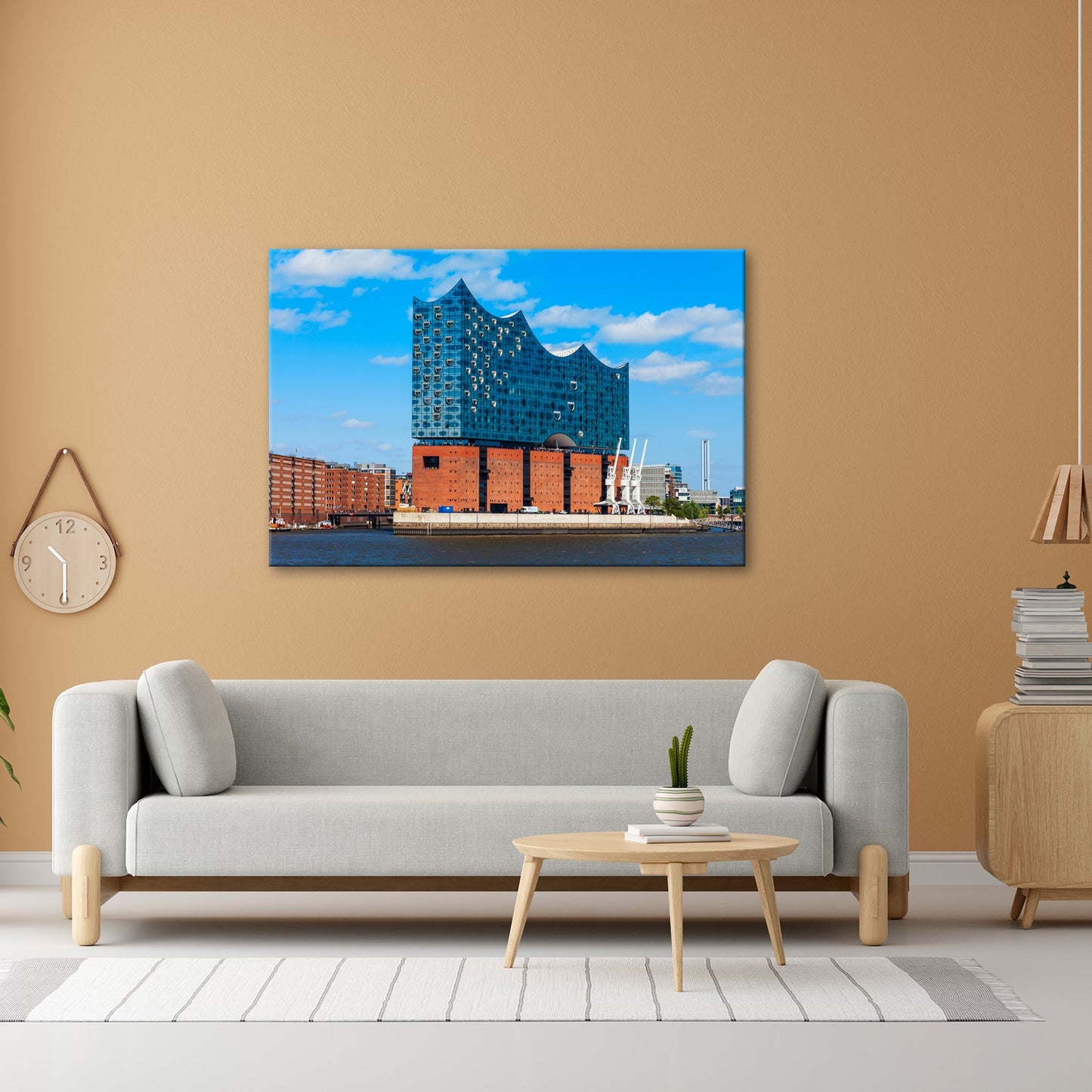 Leinwandbild Die Elbphilharmonie glänzt unter klarem Himmel am Strom. - deyoli
