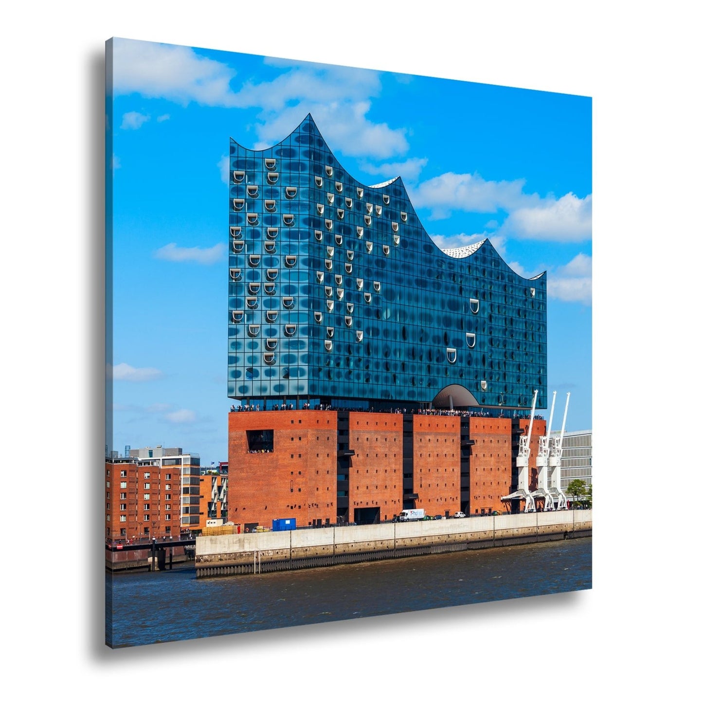 Leinwandbild Die Elbphilharmonie glänzt unter klarem Himmel am Strom. - deyoli