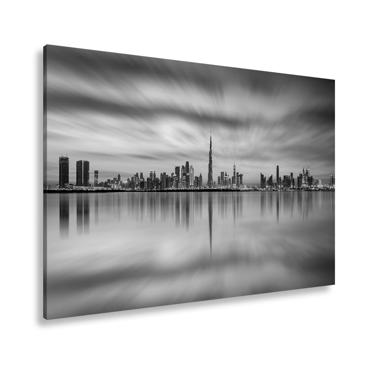 Leinwandbild Dubai XXL – Skyline spiegelt im glühenden Abendhimmel - deyoli