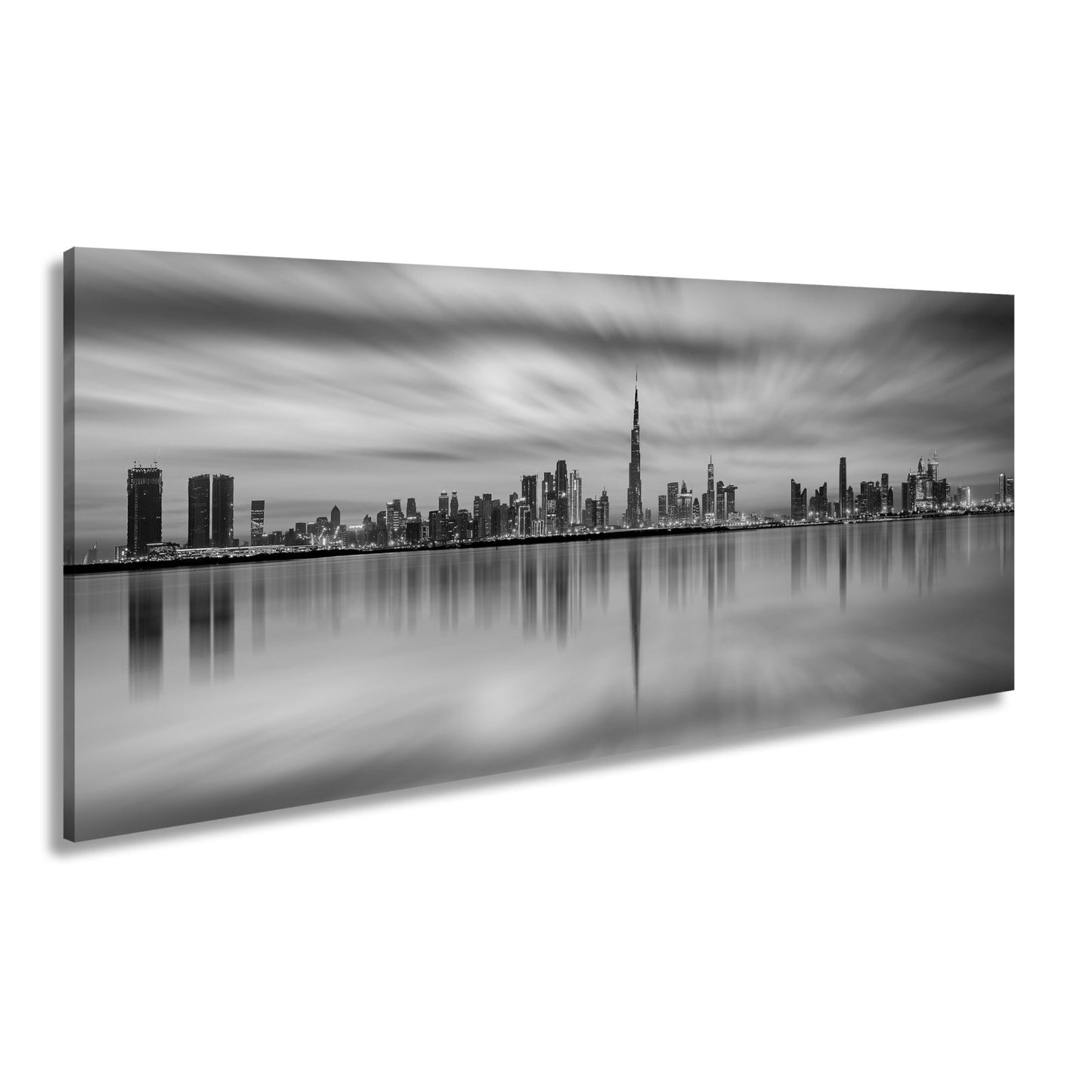 Leinwandbild Dubai XXL – Skyline spiegelt im glühenden Abendhimmel - deyoli