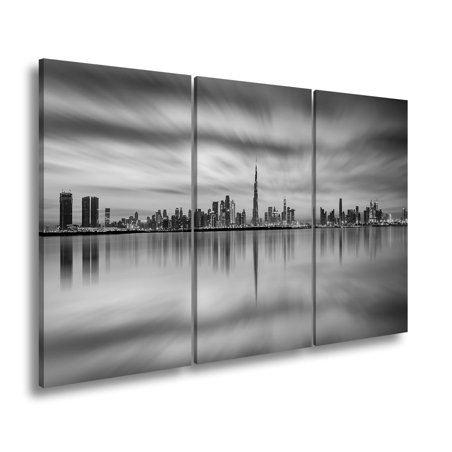Leinwandbild Dubai XXL – Skyline spiegelt im glühenden Abendhimmel - deyoli