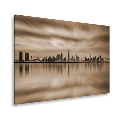 Leinwandbild Dubai XXL – Skyline spiegelt im glühenden Abendhimmel - deyoli