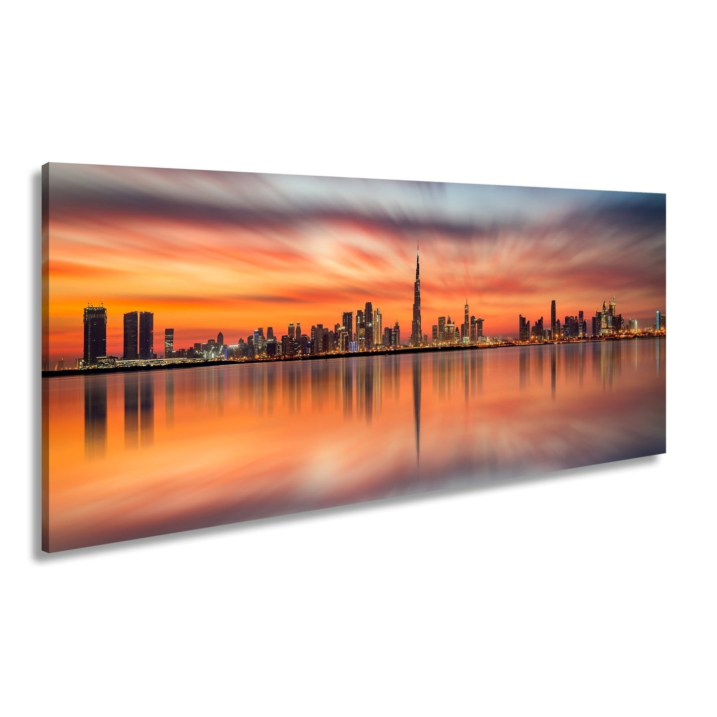 Leinwandbild Dubai XXL – Skyline spiegelt im glühenden Abendhimmel - deyoli
