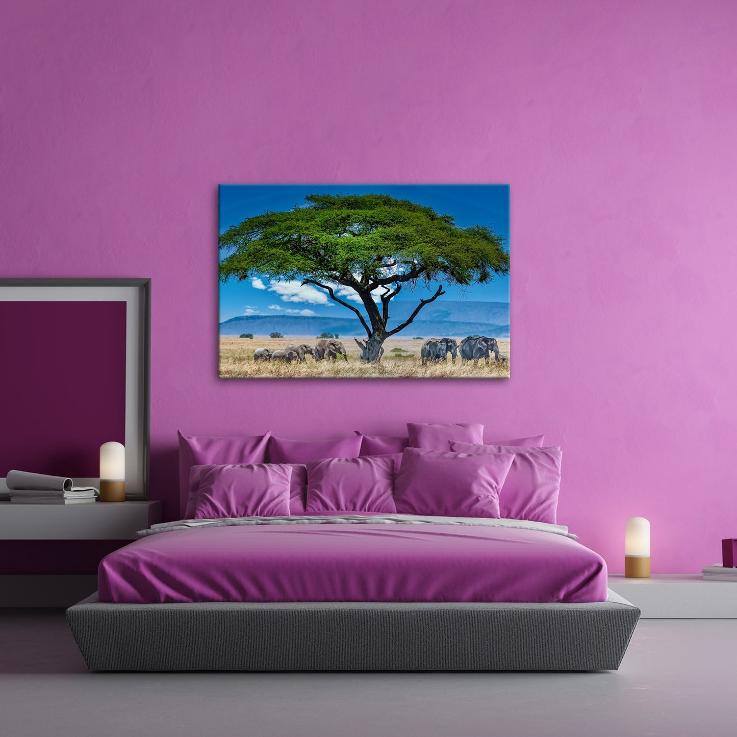 Leinwandbild Elefantenherde wandert ruhig unter einer schützenden Akazie - deyoli