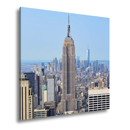 Leinwandbild Empire State erhebt sich majestätisch über Manhattans Meer aus Türmen - deyoli