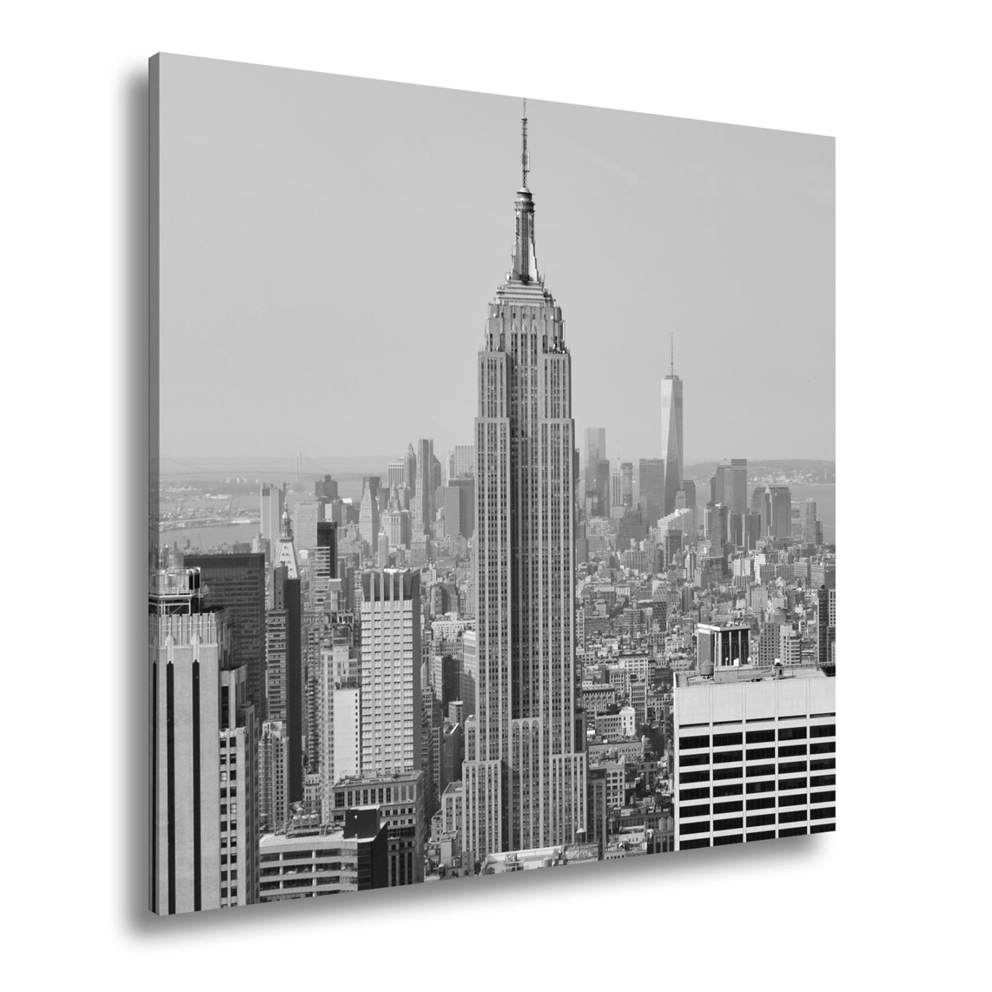Leinwandbild Empire State erhebt sich majestätisch über Manhattans Meer aus Türmen - deyoli
