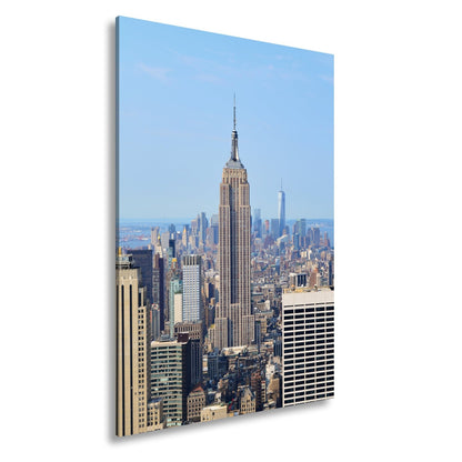Leinwandbild Empire State erhebt sich majestätisch über Manhattans Meer aus Türmen - deyoli