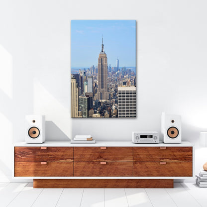 Leinwandbild Empire State erhebt sich majestätisch über Manhattans Meer aus Türmen - deyoli
