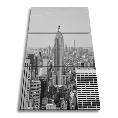 Leinwandbild Empire State erhebt sich majestätisch über Manhattans Meer aus Türmen - deyoli