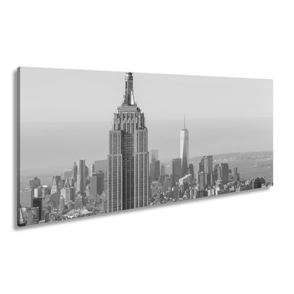 Leinwandbild Empire State thront klar über einer hellen skyline am ruhigen Morgen - deyoli