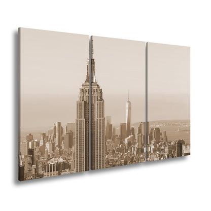 Leinwandbild Empire State thront klar über einer hellen skyline am ruhigen Morgen - deyoli