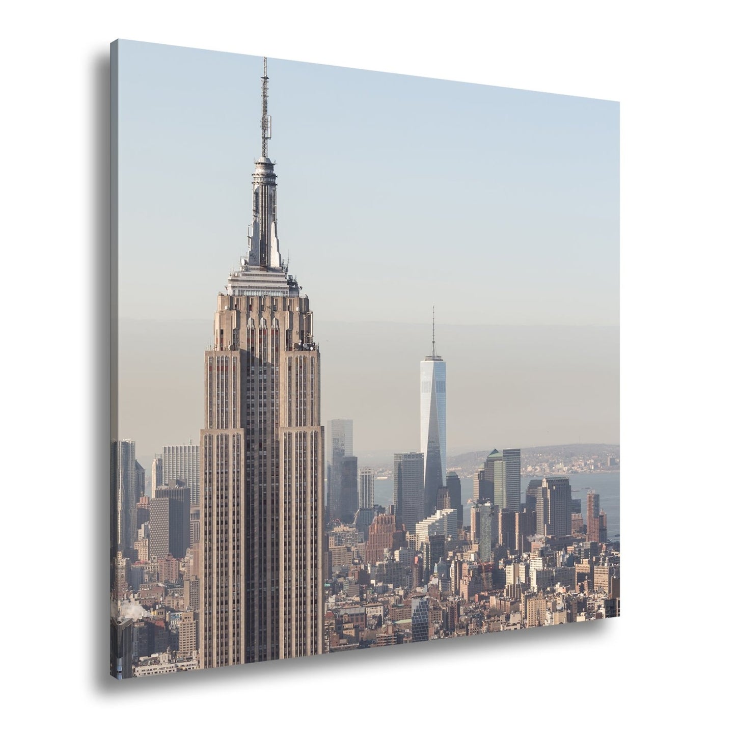 Leinwandbild Empire State thront klar über einer hellen skyline am ruhigen Morgen - deyoli