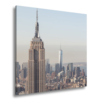 Leinwandbild Empire State thront klar über einer hellen skyline am ruhigen Morgen - deyoli