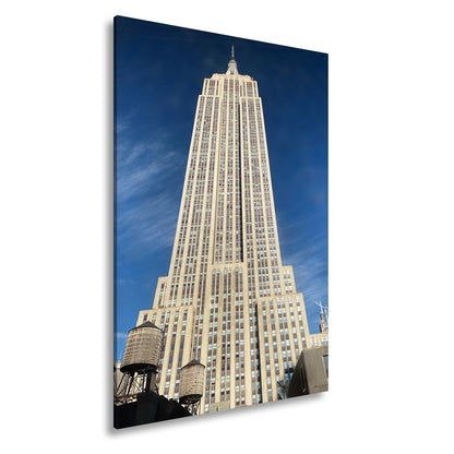 Leinwandbild Empire State XXL – Majestätisch ragt in den blauen Himmel - deyoli
