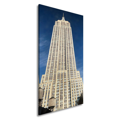 Leinwandbild Empire State XXL – Majestätisch ragt in den blauen Himmel - deyoli