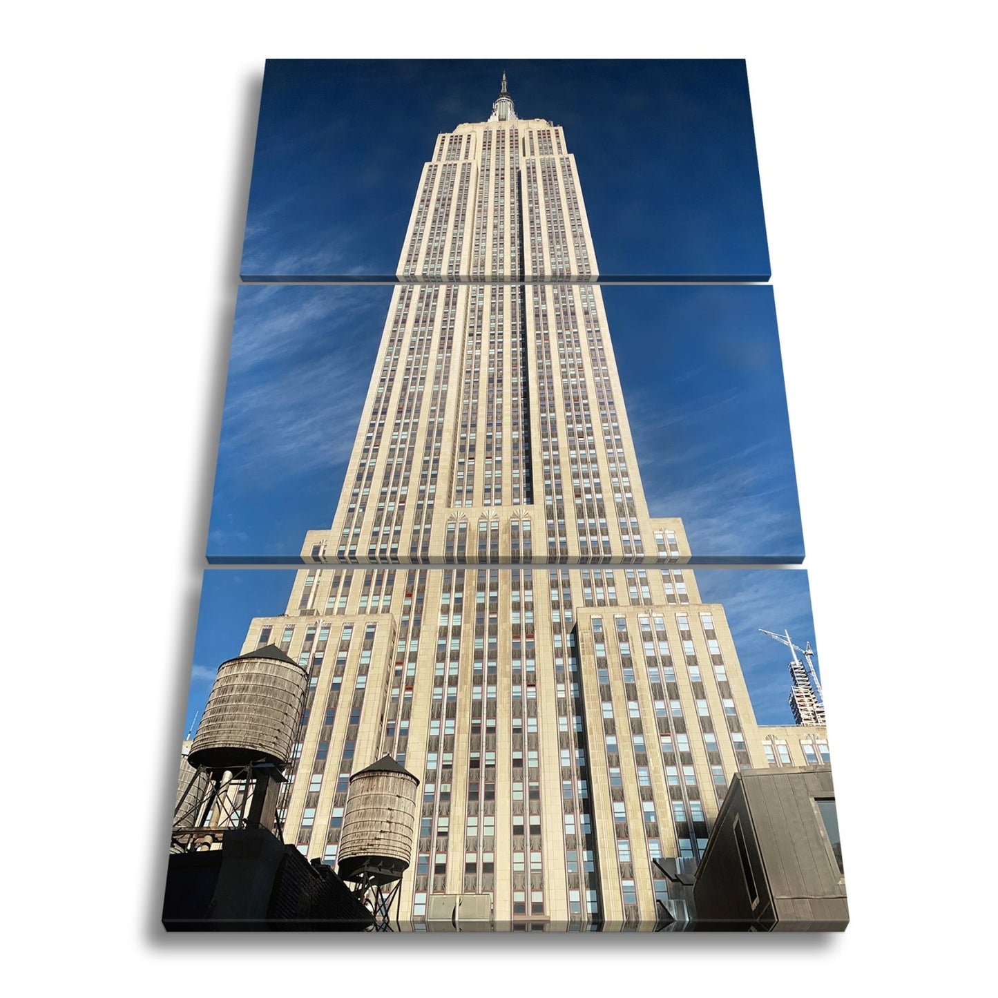 Leinwandbild Empire State XXL – Majestätisch ragt in den blauen Himmel - deyoli
