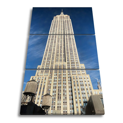 Leinwandbild Empire State XXL – Majestätisch ragt in den blauen Himmel - deyoli