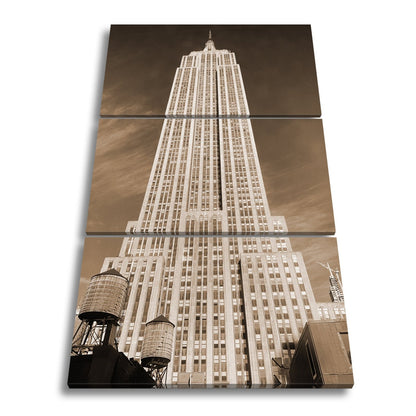 Leinwandbild Empire State XXL – Majestätisch ragt in den blauen Himmel - deyoli