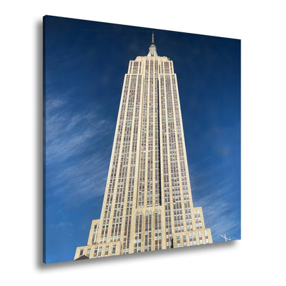 Leinwandbild Empire State XXL – Majestätisch ragt in den blauen Himmel - deyoli