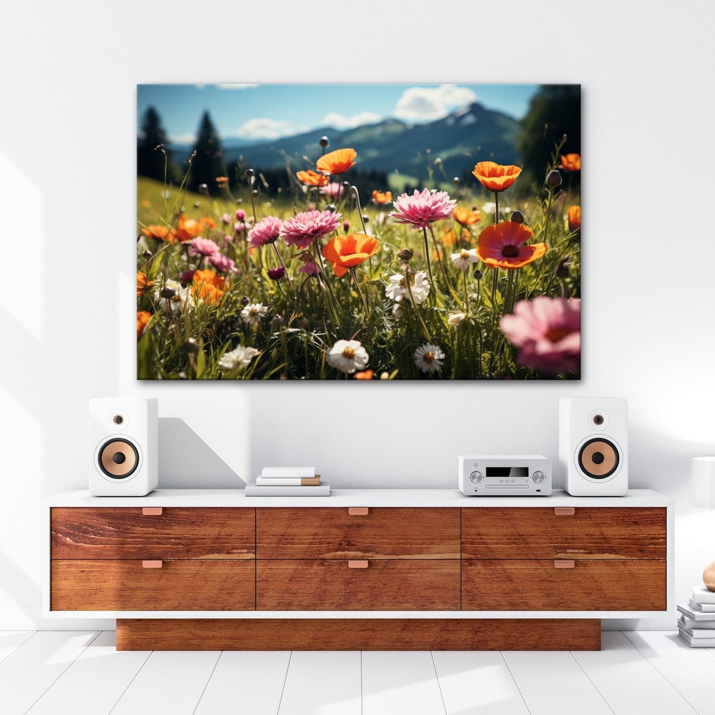 Leinwandbild Farbenfrohe Wiesenblumen tanzen vor Bergkulisse. - deyoli
