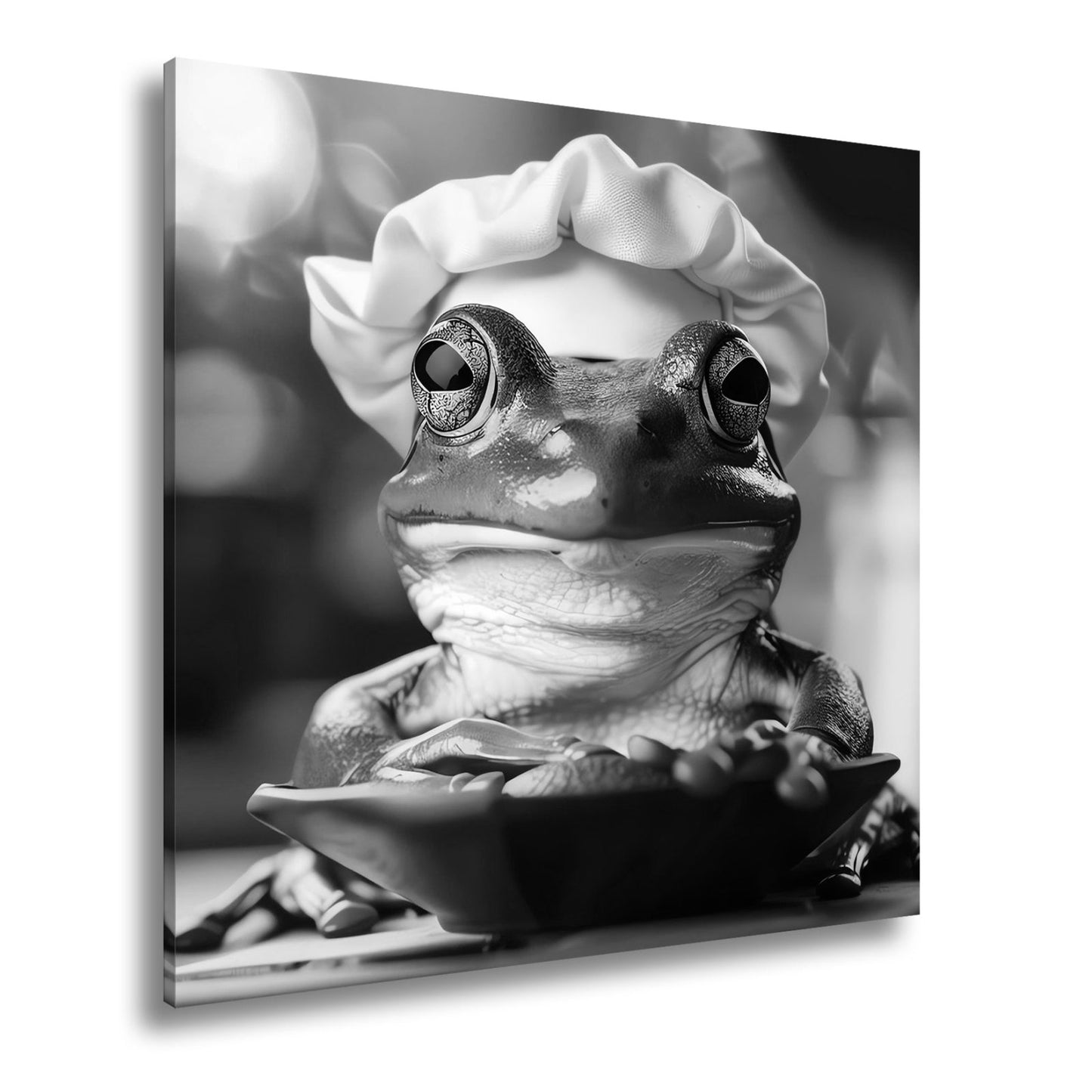 Leinwandbild Frosch mit Kochmütze – stiller Gourmet am Werk. - deyoli