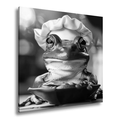 Leinwandbild Frosch mit Kochmütze – stiller Gourmet am Werk. - deyoli