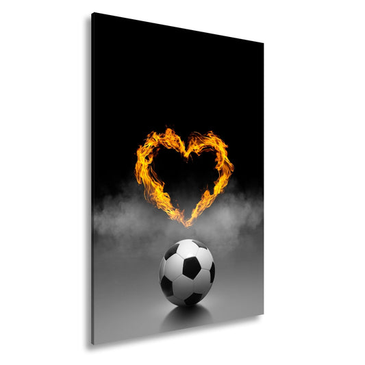 Leinwandbild Fußballliebe brennt – Herz aus Flammen über dem Spielball. - deyoli