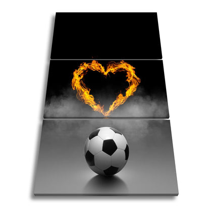 Leinwandbild Fußballliebe brennt – Herz aus Flammen über dem Spielball. - deyoli