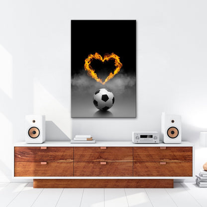 Leinwandbild Fußballliebe brennt – Herz aus Flammen über dem Spielball. - deyoli