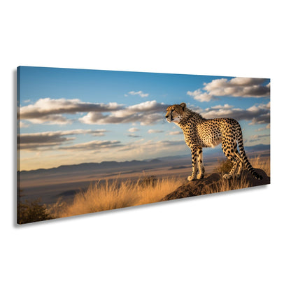 Leinwandbild Gepard auf Gipfel – Wächter der Savanne bei Sonnenlicht. - deyoli
