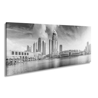 Leinwandbild Glitzernde Skyline spiegelt sich im türkisblauen Wasser Dubais - deyoli