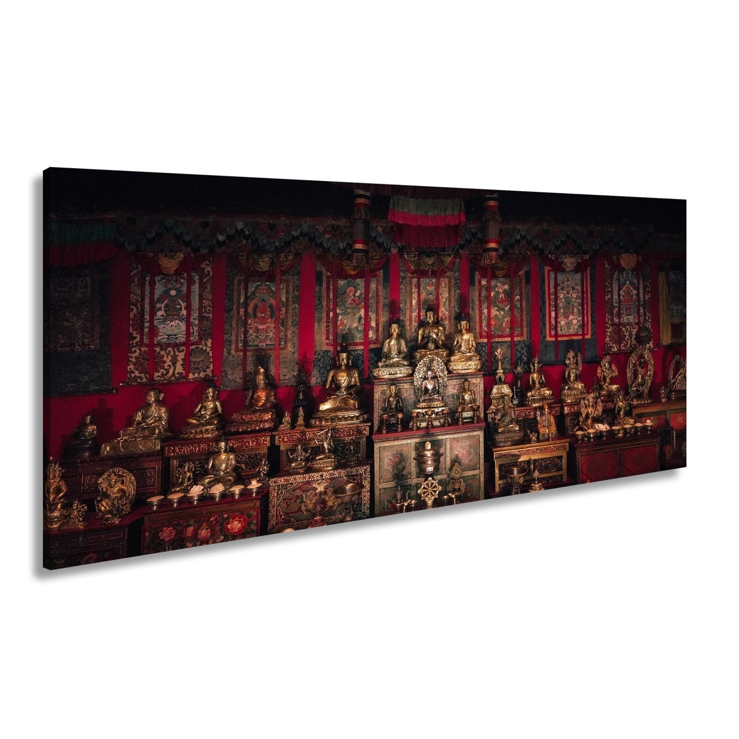 Leinwandbild Goldene Buddhas thronen in einem Meer aus rotem Samt. - deyoli