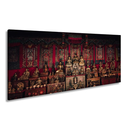 Leinwandbild Goldene Buddhas thronen in einem Meer aus rotem Samt. - deyoli