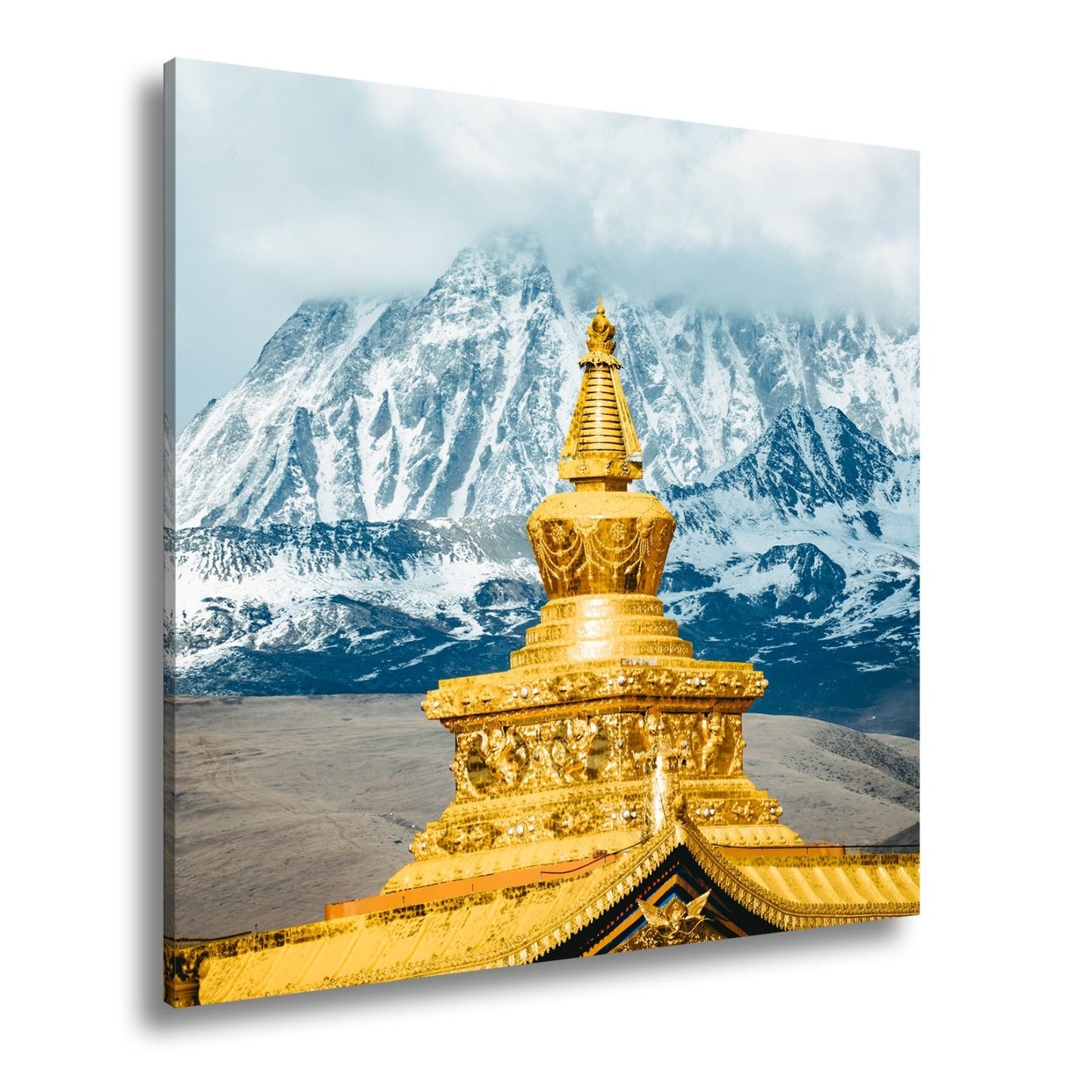 Leinwandbild Goldene Stupa glänzt vor eisiger Bergpracht im Himmelstor. - deyoli