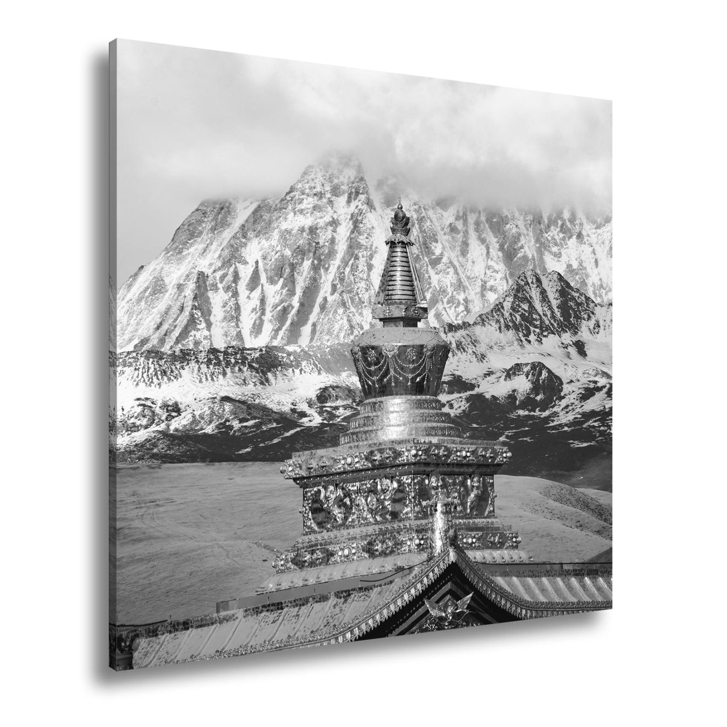 Leinwandbild Goldene Stupa glänzt vor eisiger Bergpracht im Himmelstor. - deyoli