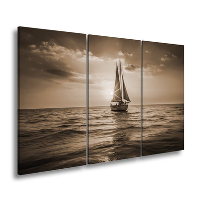 Leinwandbild Goldene Wellen tragen das Boot ins Licht des Abends. - deyoli